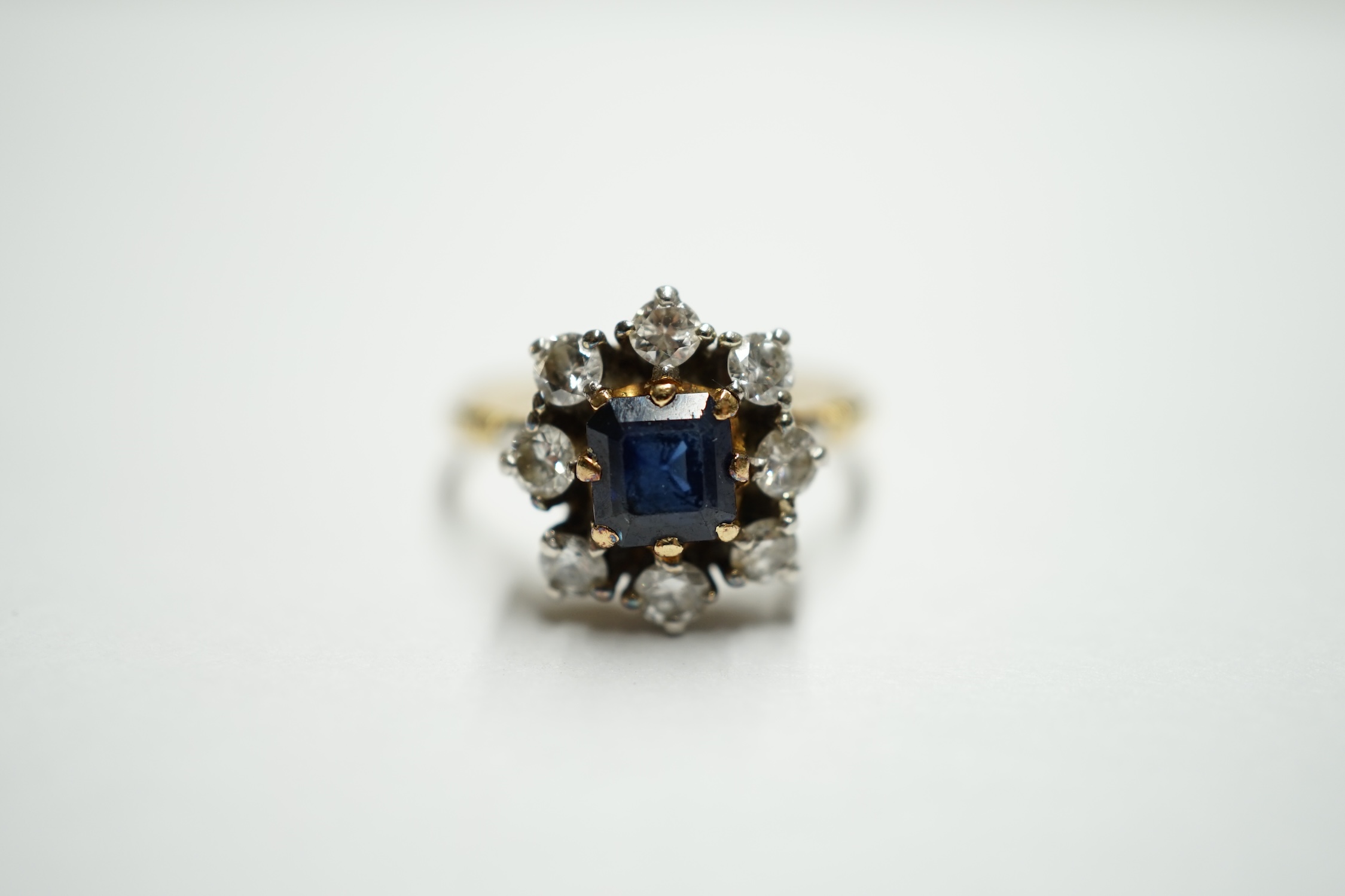 An 18ct gold, sapphire and diamond set flower head cluster ring, size O, gross weight 3.8 grams. Condition - fair